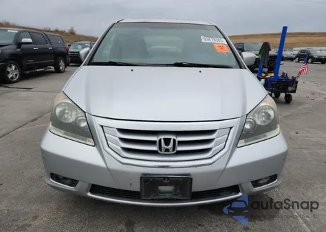 2010 Honda Odyssey Touring z USA, uszkodzony, nr VIN 5FNRL3H93AB114404